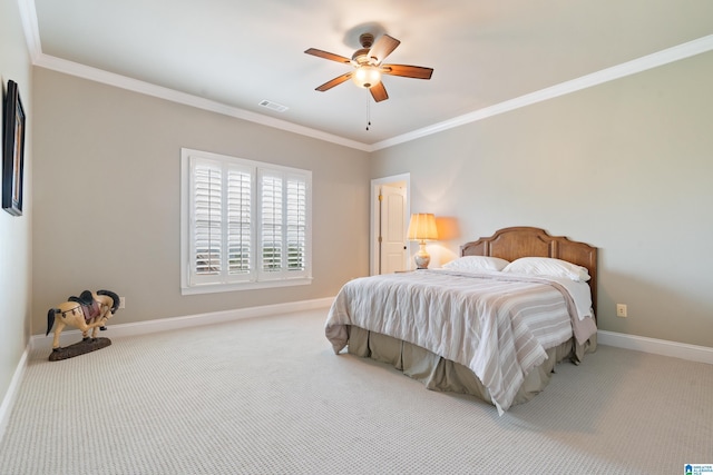 bedroom with ornamental molding, baseboards, visible vents, and light carpet