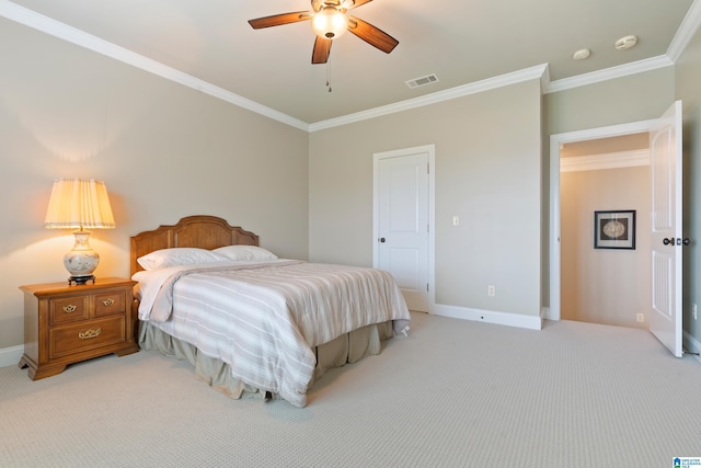 bedroom with crown molding, baseboards, visible vents, and light carpet