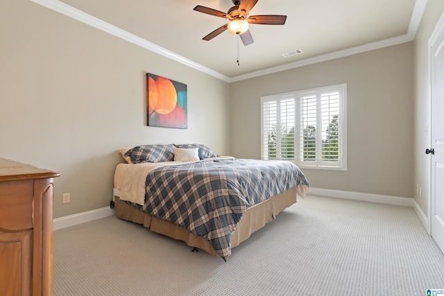 bedroom featuring visible vents, baseboards, light colored carpet, and ornamental molding