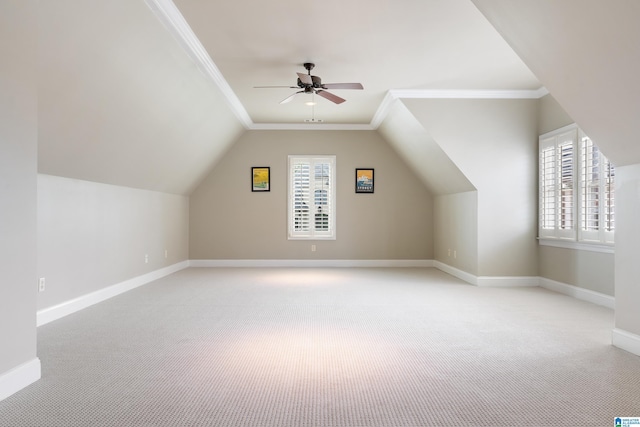 bonus room featuring baseboards, a wealth of natural light, and light carpet