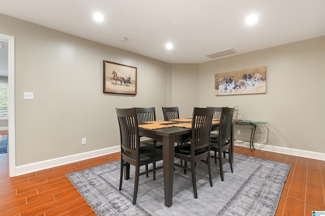 dining area with recessed lighting, visible vents, baseboards, and wood finished floors