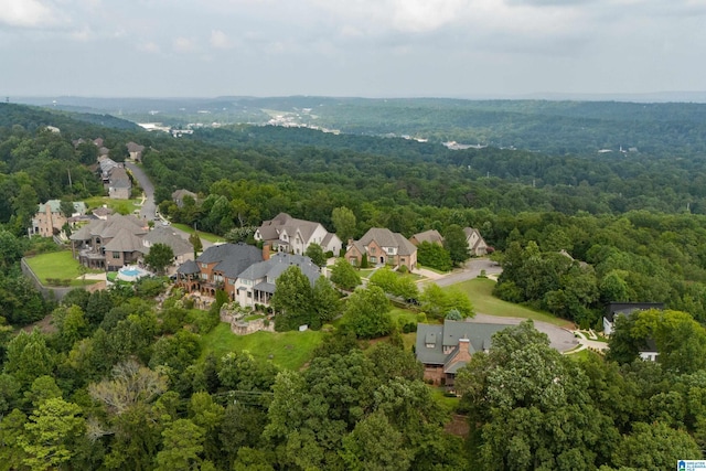 bird's eye view featuring a view of trees and a residential view