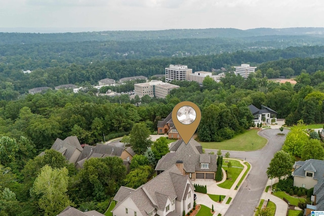 aerial view featuring a wooded view