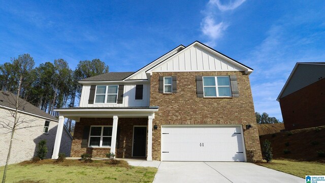 craftsman-style home featuring a front yard and a garage