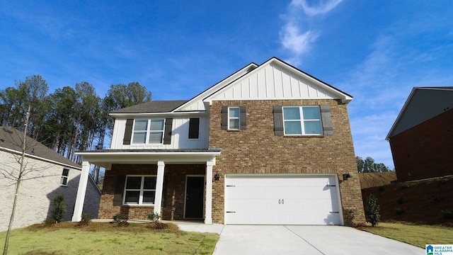 view of front of house featuring brick siding, a porch, concrete driveway, an attached garage, and board and batten siding