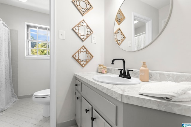 bathroom featuring vanity, toilet, a shower with shower curtain, and tile patterned flooring