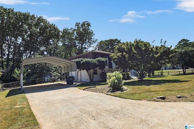 view of front of house with a carport and a front lawn