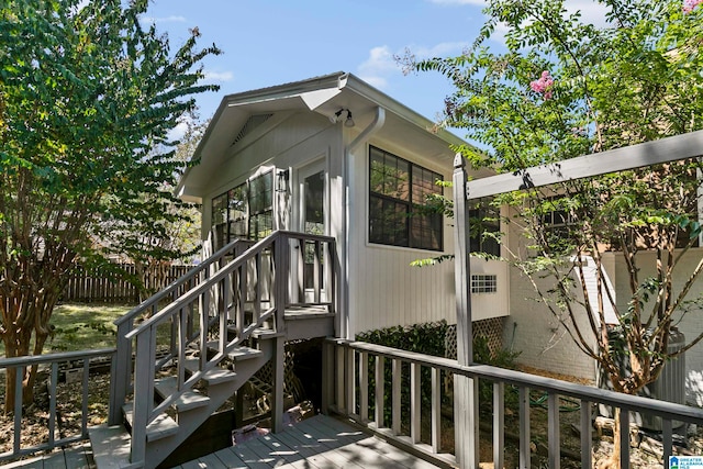 doorway to property featuring a wooden deck