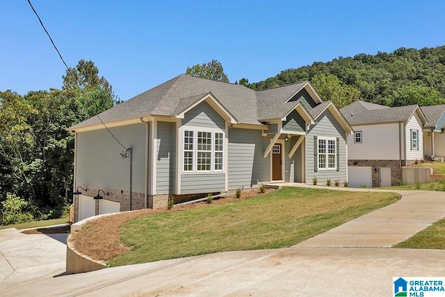 view of front of property with a garage and a front yard