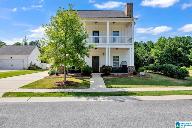 view of front of property with a front lawn, a porch, and a balcony