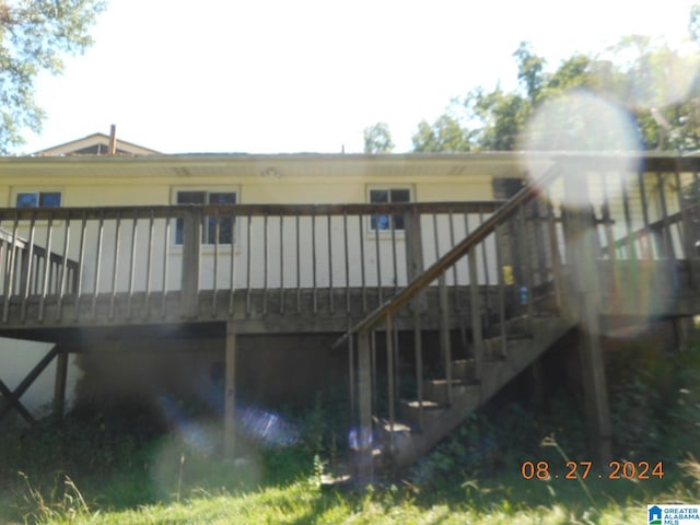 back of property featuring a deck