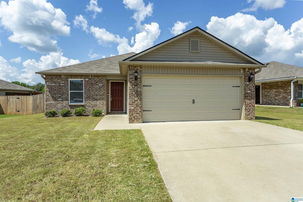 ranch-style house featuring brick siding, a front lawn, and an attached garage