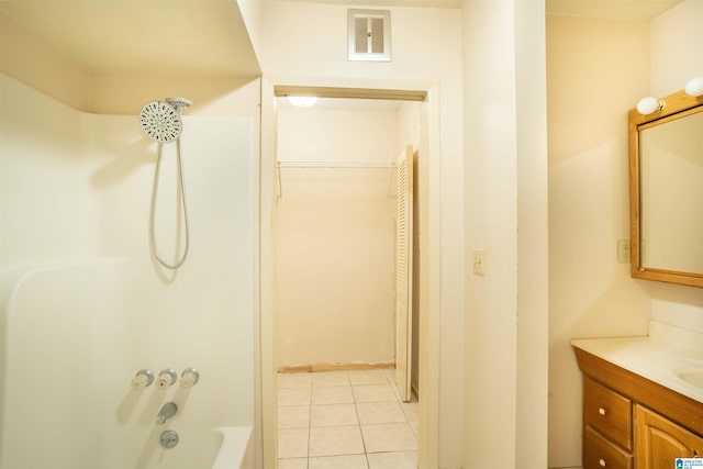 bathroom with vanity, tile patterned flooring, and shower / bath combination