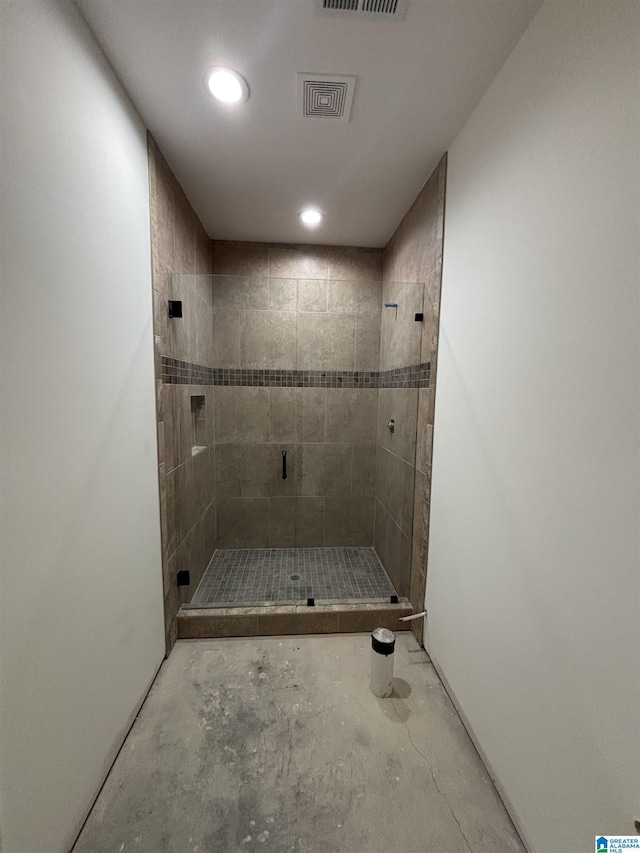 bathroom featuring walk in shower and concrete floors