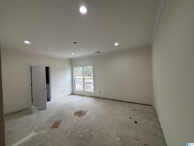 unfurnished room featuring crown molding