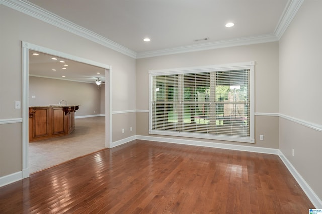 unfurnished room featuring baseboards, light wood finished floors, recessed lighting, and crown molding