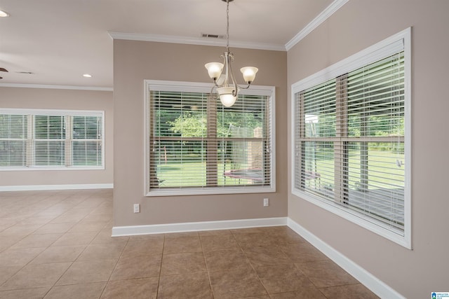 unfurnished dining area featuring baseboards, tile patterned flooring, and crown molding