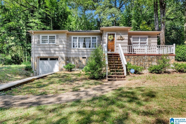 view of front of home with a garage and a deck