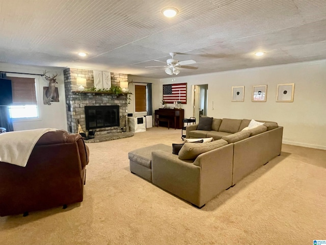 living room with light colored carpet, a brick fireplace, ceiling fan, and a textured ceiling