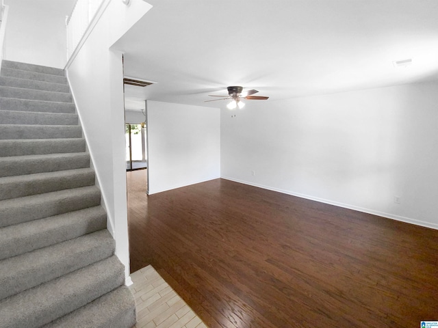 interior space featuring wood-type flooring and ceiling fan