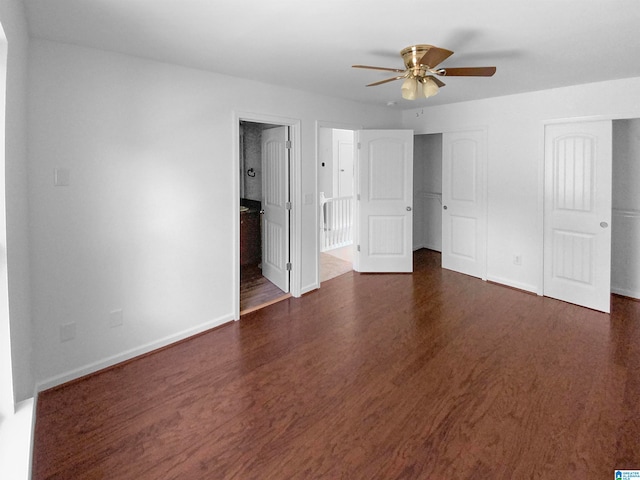 unfurnished bedroom with ceiling fan and dark hardwood / wood-style floors