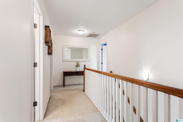 corridor with light colored carpet