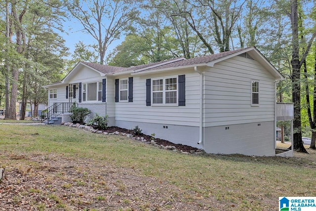 ranch-style home with a front yard