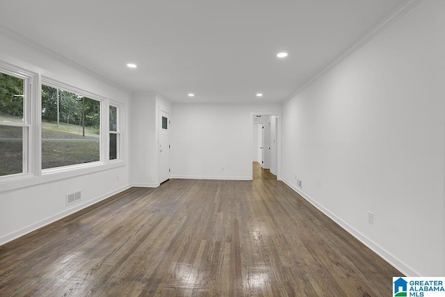 2604 Wood Dr NE, Center Point, AL 35215 - interior space with visible vents, baseboards, ornamental molding, recessed lighting, and dark wood-type flooring