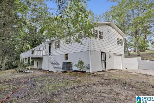 2604 Wood Dr NE, Center Point, AL 35215 - exterior space with stairs, central AC unit, a deck, and a garage