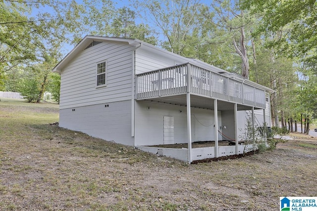 2604 Wood Dr NE, Center Point, AL 35215 - view of side of property with a wooden deck