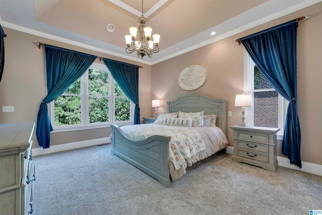 bedroom with ornamental molding, light colored carpet, a notable chandelier, and a raised ceiling