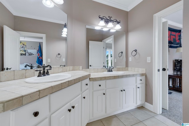 bathroom with crown molding, vanity, and tile patterned floors