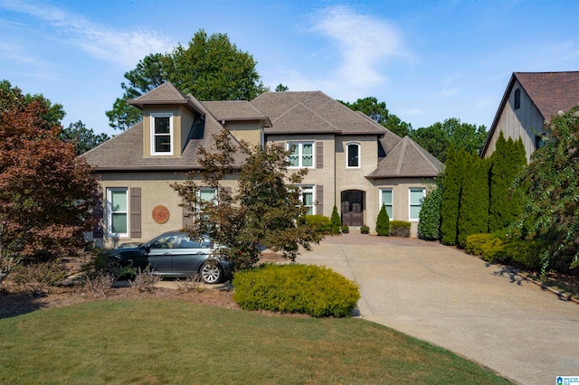 view of front of home with a front lawn