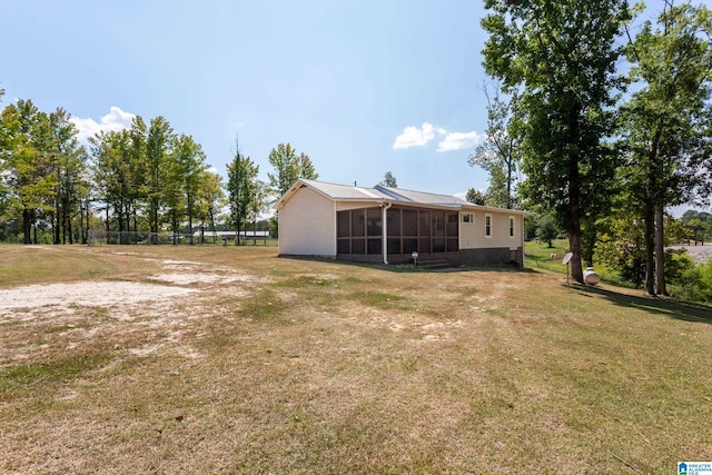 view of yard with a sunroom