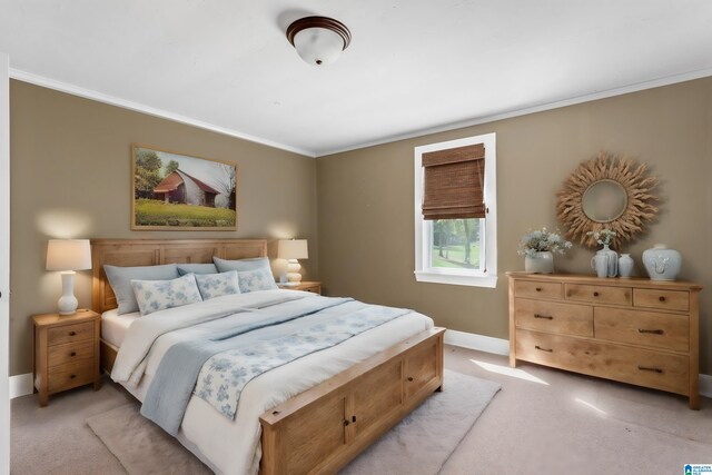 carpeted bedroom featuring ornamental molding