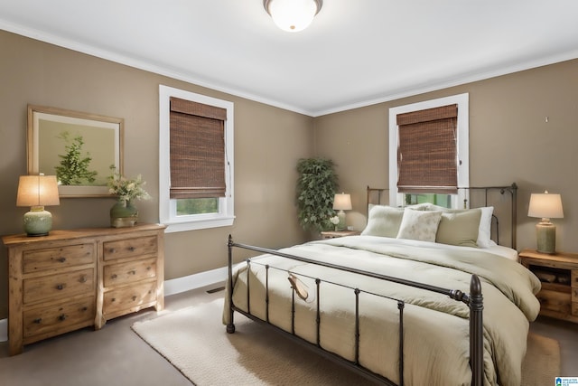 carpeted bedroom featuring ornamental molding