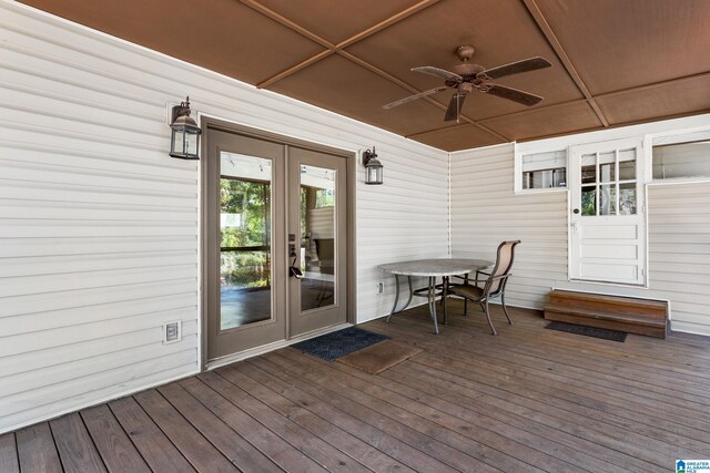 wooden deck featuring ceiling fan