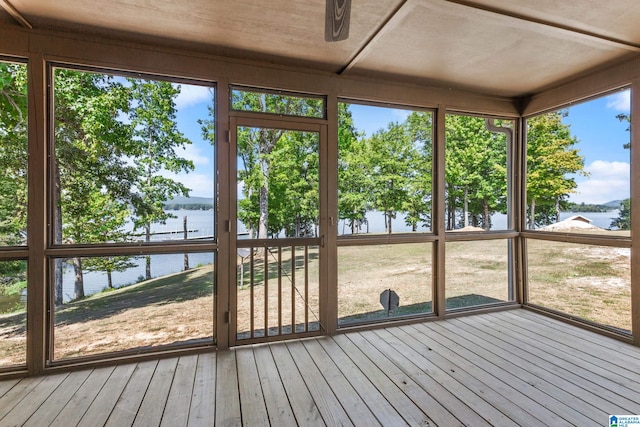 unfurnished sunroom with a water view