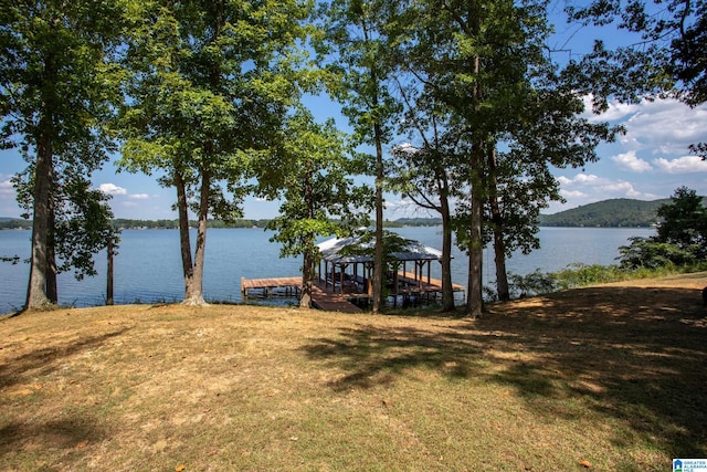 exterior space featuring a yard and a water view