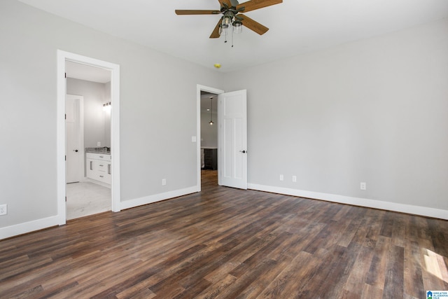 unfurnished bedroom featuring ceiling fan, dark hardwood / wood-style floors, and ensuite bathroom