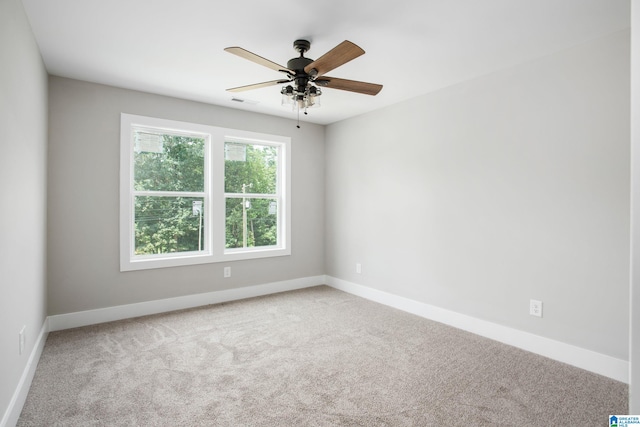 carpeted empty room with ceiling fan