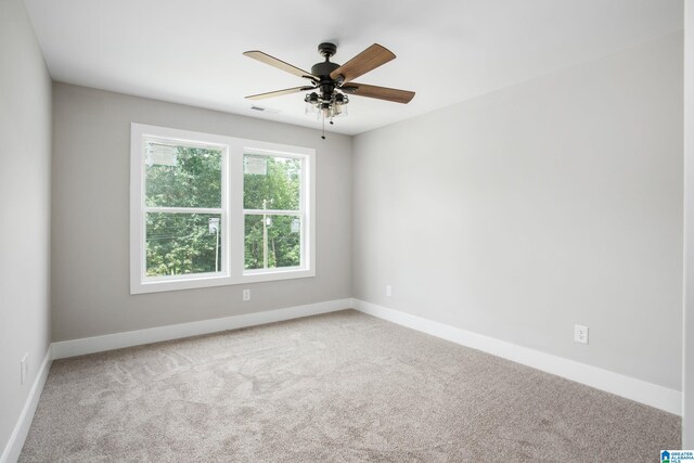 unfurnished bedroom with ceiling fan and carpet flooring