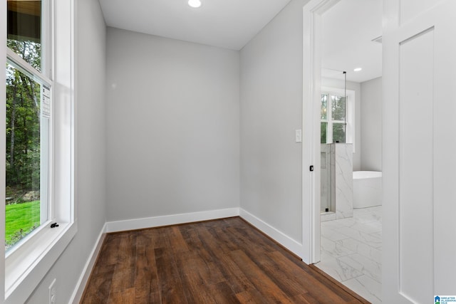 unfurnished room featuring recessed lighting, marble finish floor, and baseboards