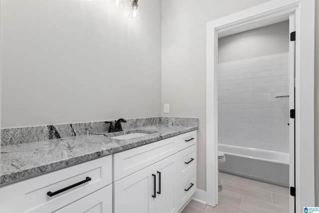 full bath with toilet, tile patterned flooring, and vanity