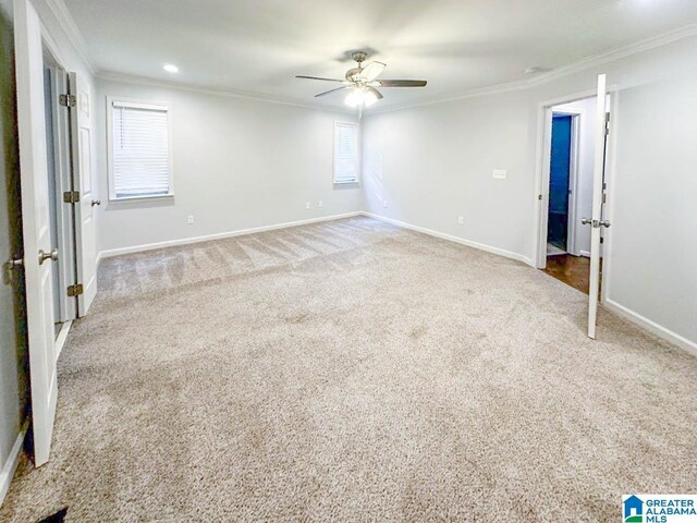 unfurnished room featuring crown molding, ceiling fan, and carpet flooring