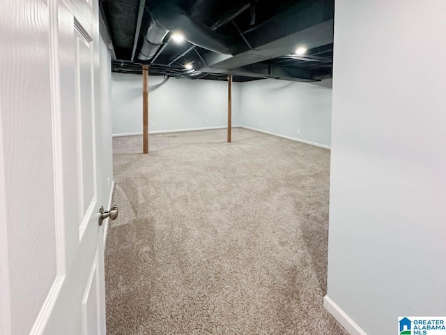 finished basement featuring carpet and baseboards