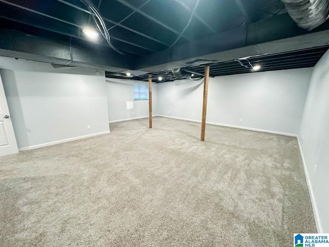 basement with carpet flooring and baseboards