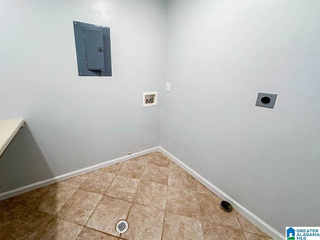 washroom with hookup for a washing machine, hookup for an electric dryer, laundry area, baseboards, and electric panel