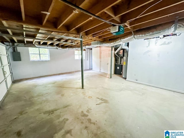 basement with water heater and electric panel