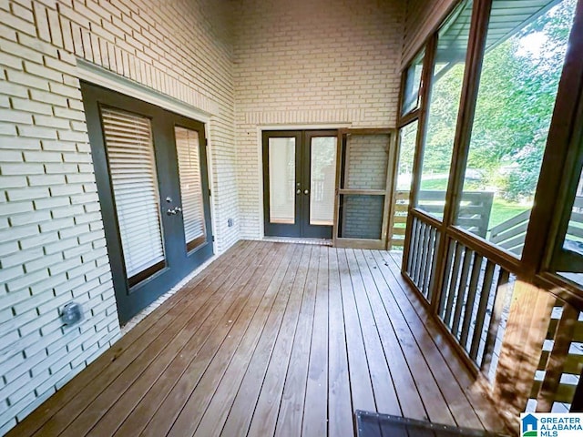 unfurnished sunroom with french doors